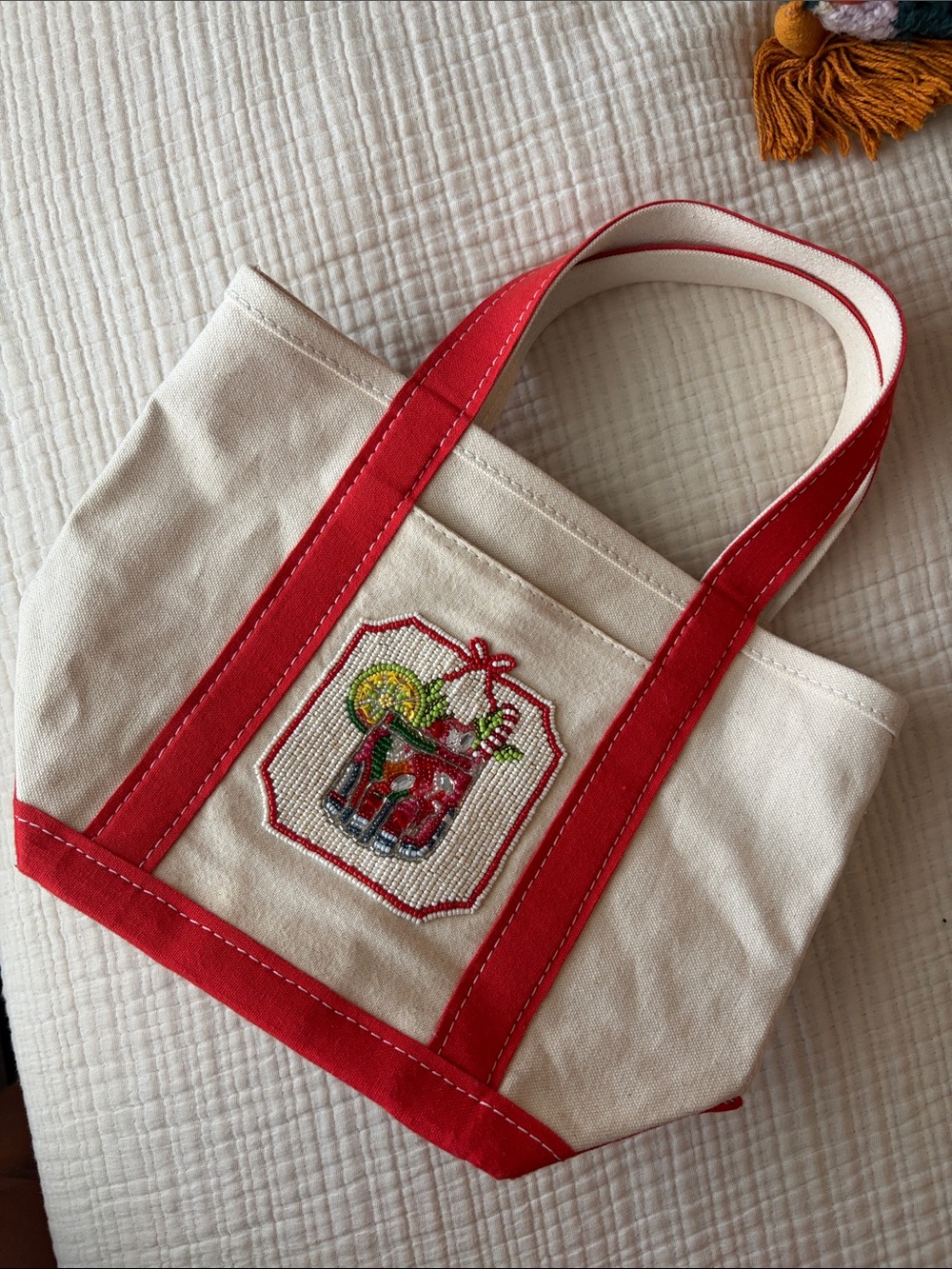 Anthropologie Cream Canvas Tote with Red Trim and Embroidered Motif